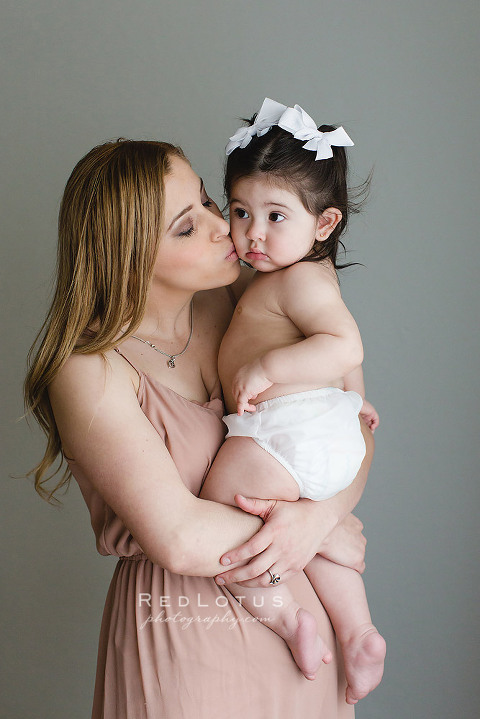 motherhood portraits beautiful and natural in studio with neutral colors