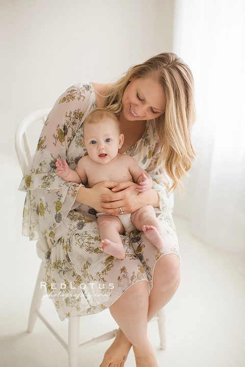 mom holding 6 month old baby