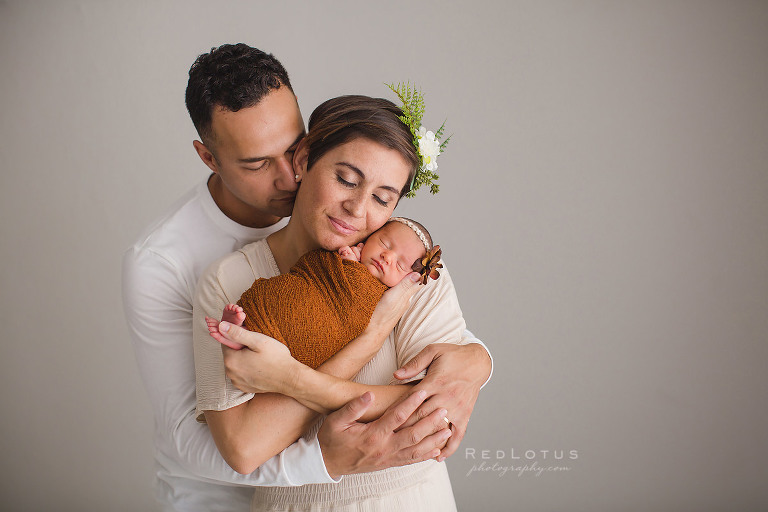 newborn photography family pose loving