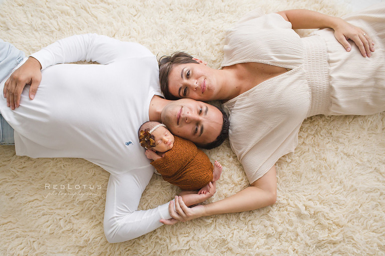 newborn photography family pose on floor