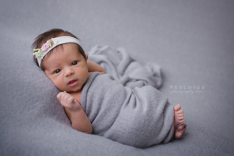 newborn photography pose baby with eyes open