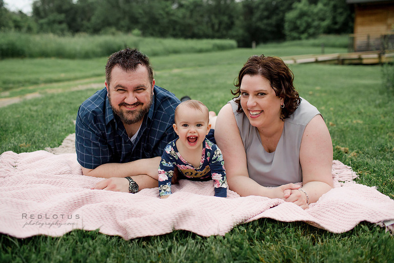toddler and family portrait pose
