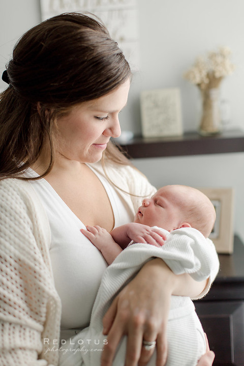 newborn photography mother holding baby