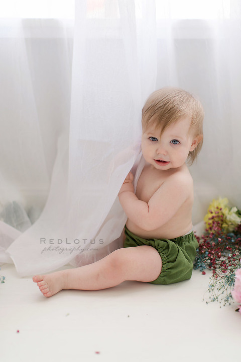 toddler baby one year old photos peeking behind curtain