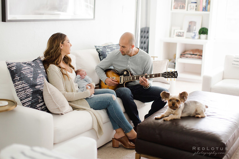 newborn session dad plays guitar for baby