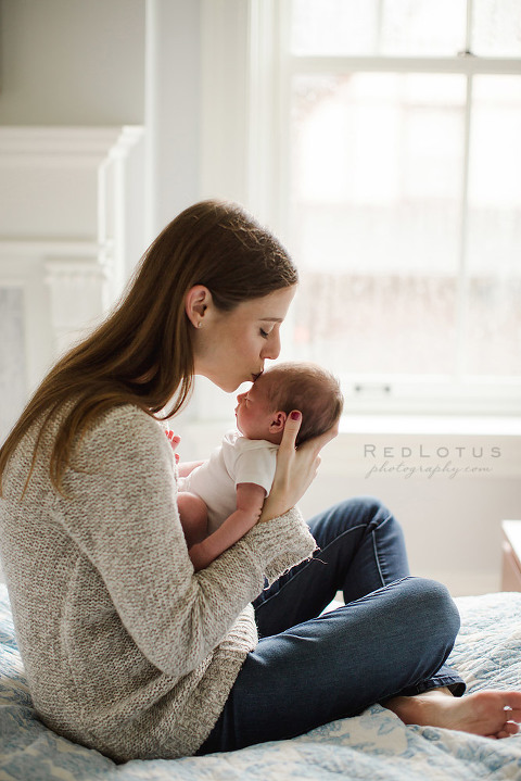 newborn photography mother and baby mom kissing newborn home session lifestyle newborn photos