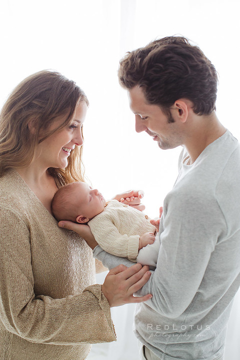 newborn photography Pittsburgh studio parents looking at baby