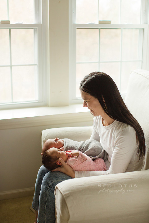 newborn twin photography mother and twins by window natural light