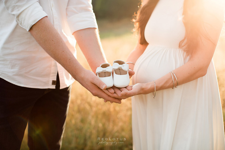maternity photo ideas holding baby shoes