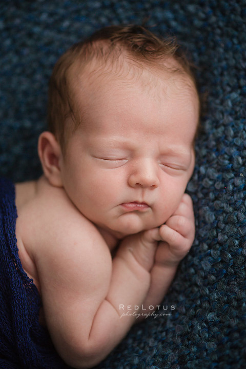 newborn baby sleeping on blue blanket newborn photographer Pittsburgh