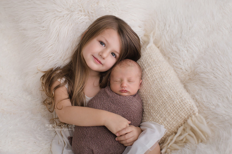 newborn and sibling baby boy big sister
