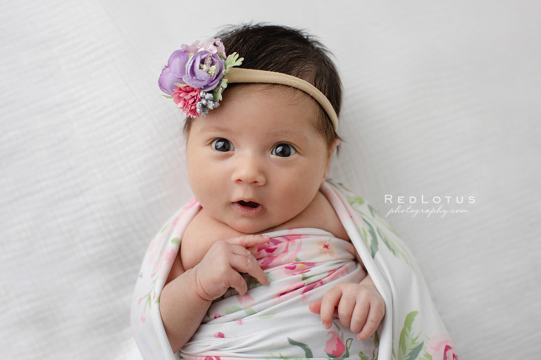 newborn baby awake with bright eyes