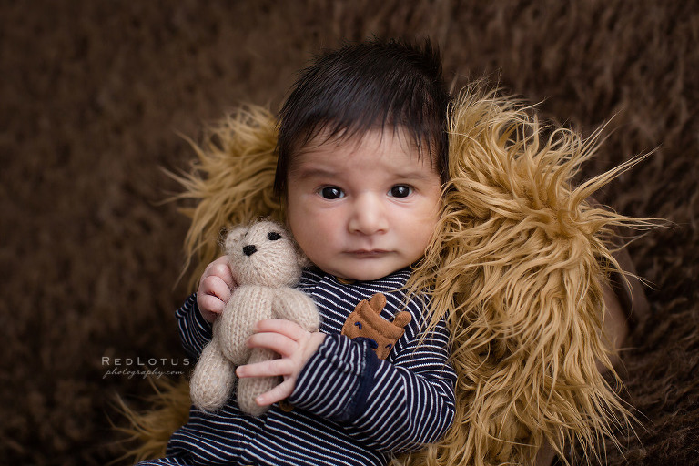 newborn baby bot with teddy bear