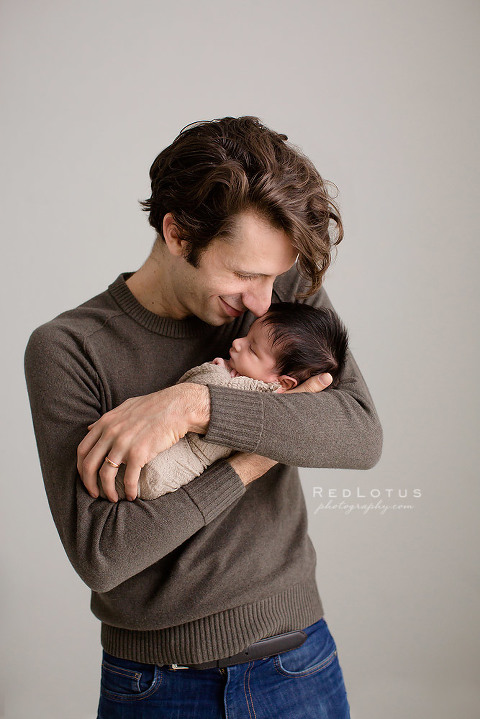 newborn baby and father