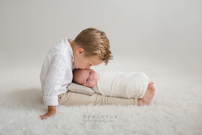 newborn and brother