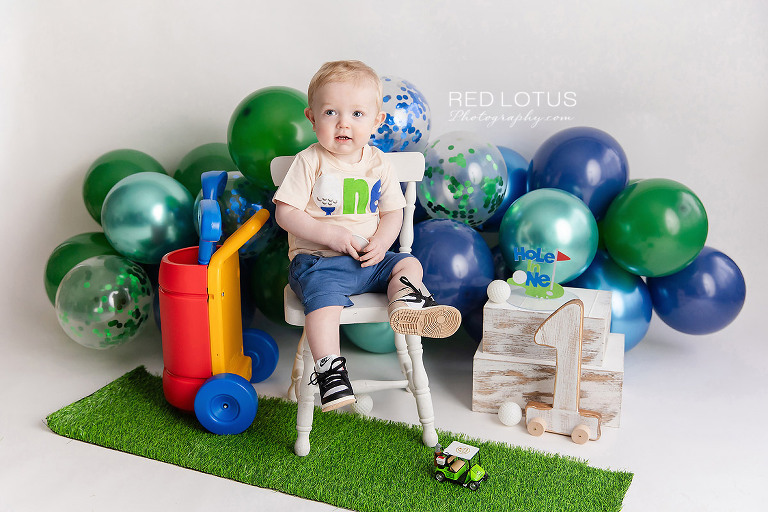 golf themed cake smash photo session for one year old boy