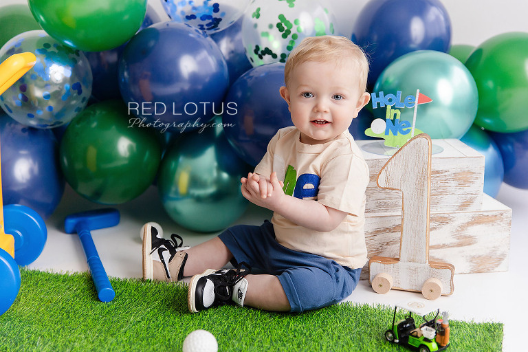 golf themed cake smash photo session for one year old boy