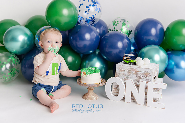 golf themed cake smash photo session for one year old boy