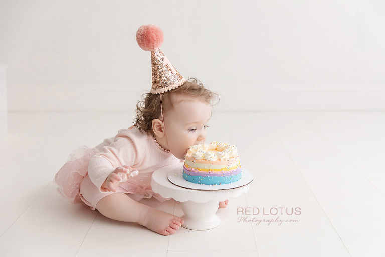 one year old eating birthday cake no hands
