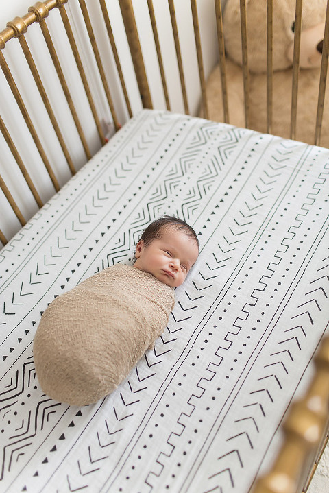 home newborn session baby in a crib