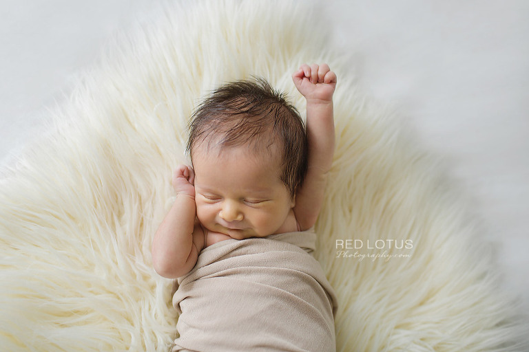 home newborn session cute picture of baby stretching